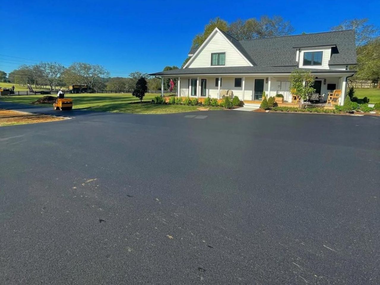 A large tarmac driveway laid in front of a house