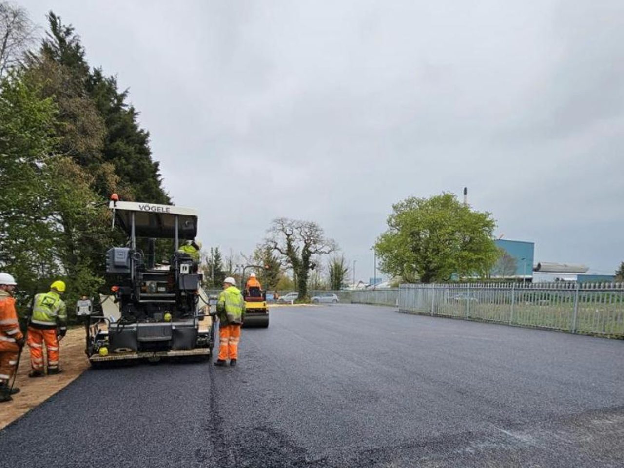 A large commercial tarmac area being resurfaced